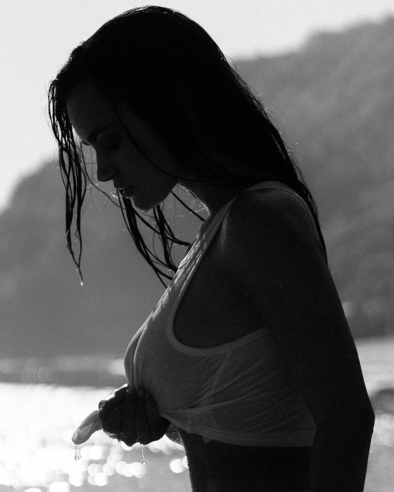 Black and white silhouette portrait by the sea